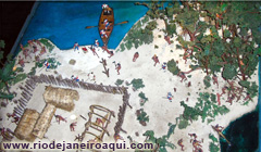 Maquete de aldeia dos primitivos habitantes e contato com navegantes no s&eacute;culo 16